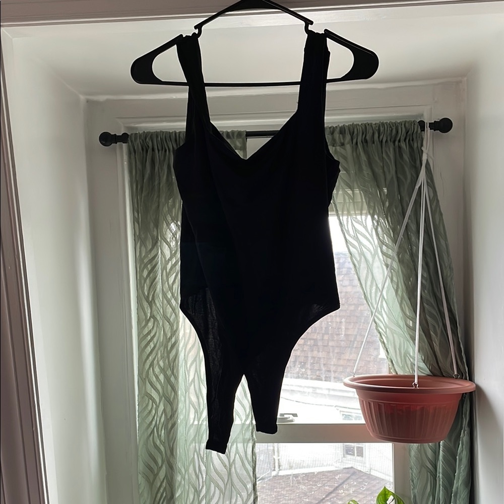 Chic Black Bodysuit with Textured Fabric and Scoop Neckline